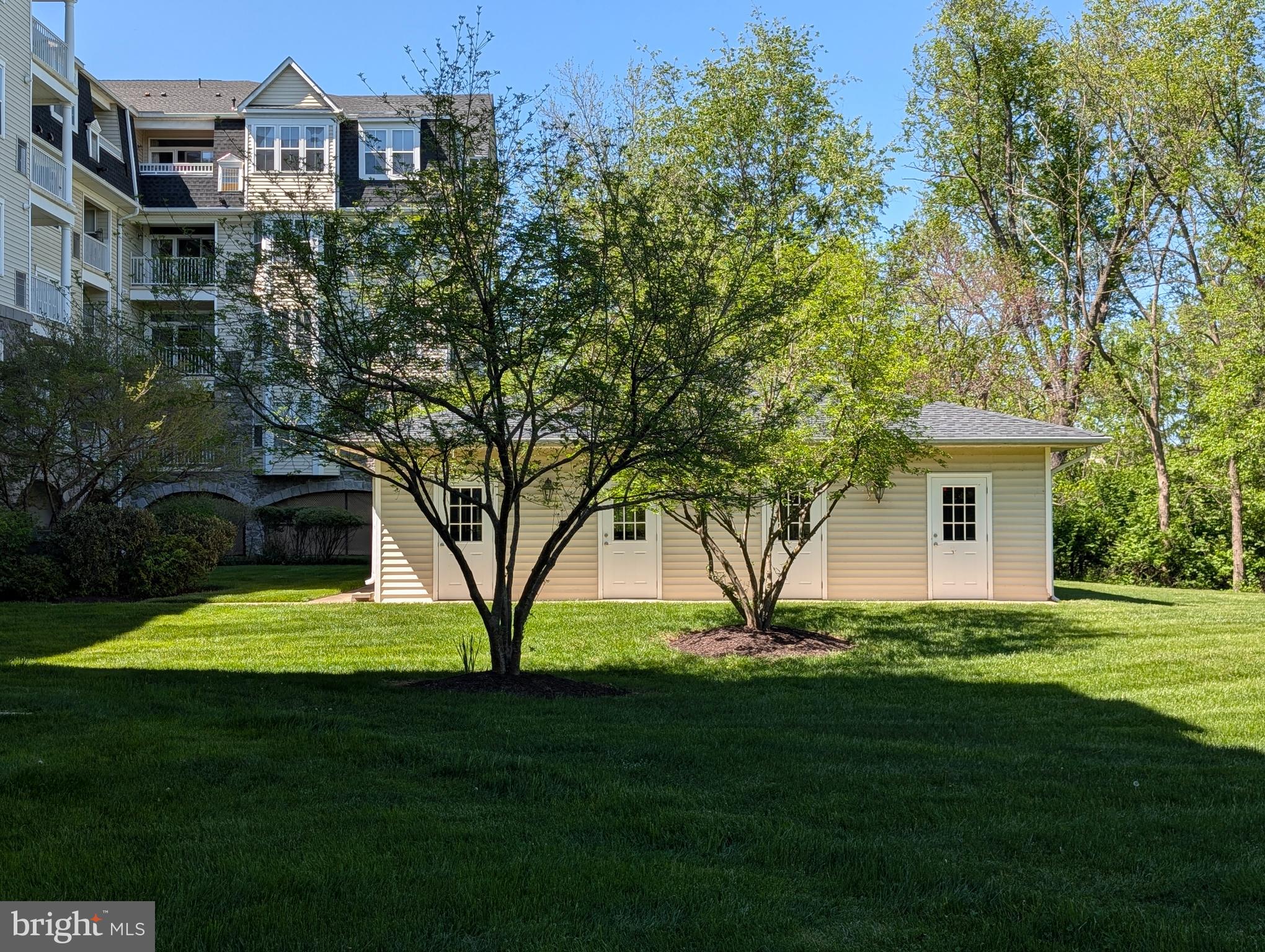 2500 Waterside Drive, Unit 306 Frederick, MD 21701 - Photo 48 of 50 a view of a house next to a big yard