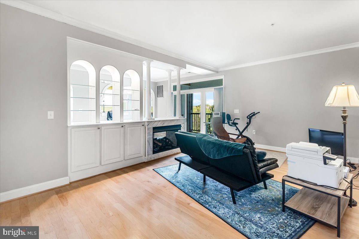 2500 Waterside Drive, Unit 306 Frederick, MD 21701 - Photo 8 of 50 a living room with furniture and a large window