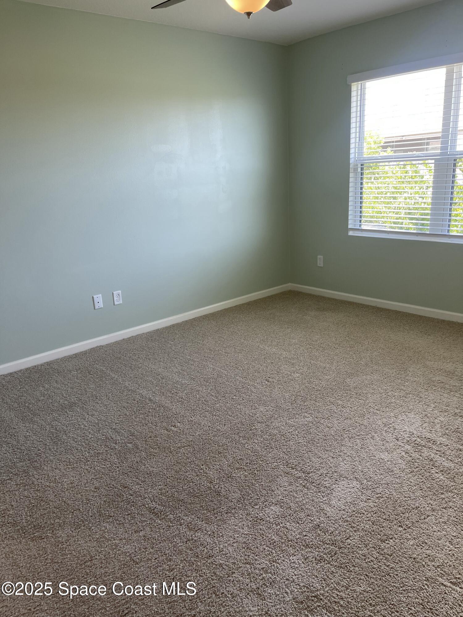 7055 Topaz Drive Grant-Valkaria, FL 32949 - Photo 15 of 24 an empty room with a window
