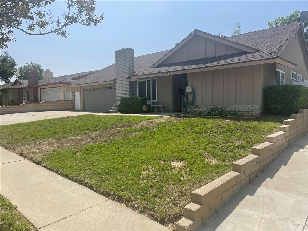 3075 East Mirada Road Highland, CA 92346 - Photo 1 of 1 a front view of a house with garden