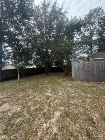 a view of outdoor space with deck and yard