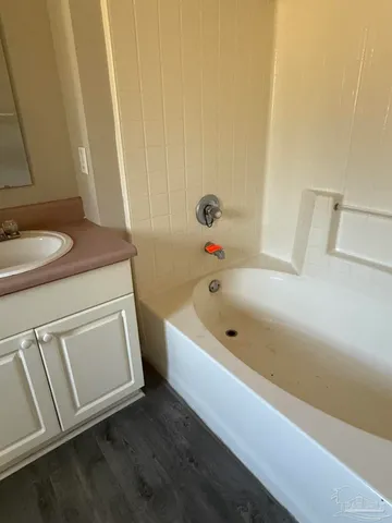 a bathroom with a sink a toilet and a bathtub