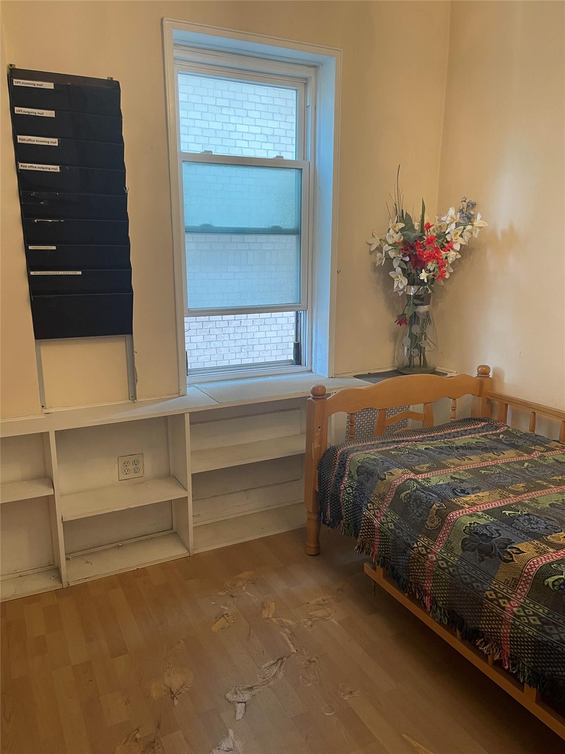 134-54 Maple Avenue, Unit 2S Queens, NY 11355 - Photo 11 of 18 a bedroom with a bed and a potted plant