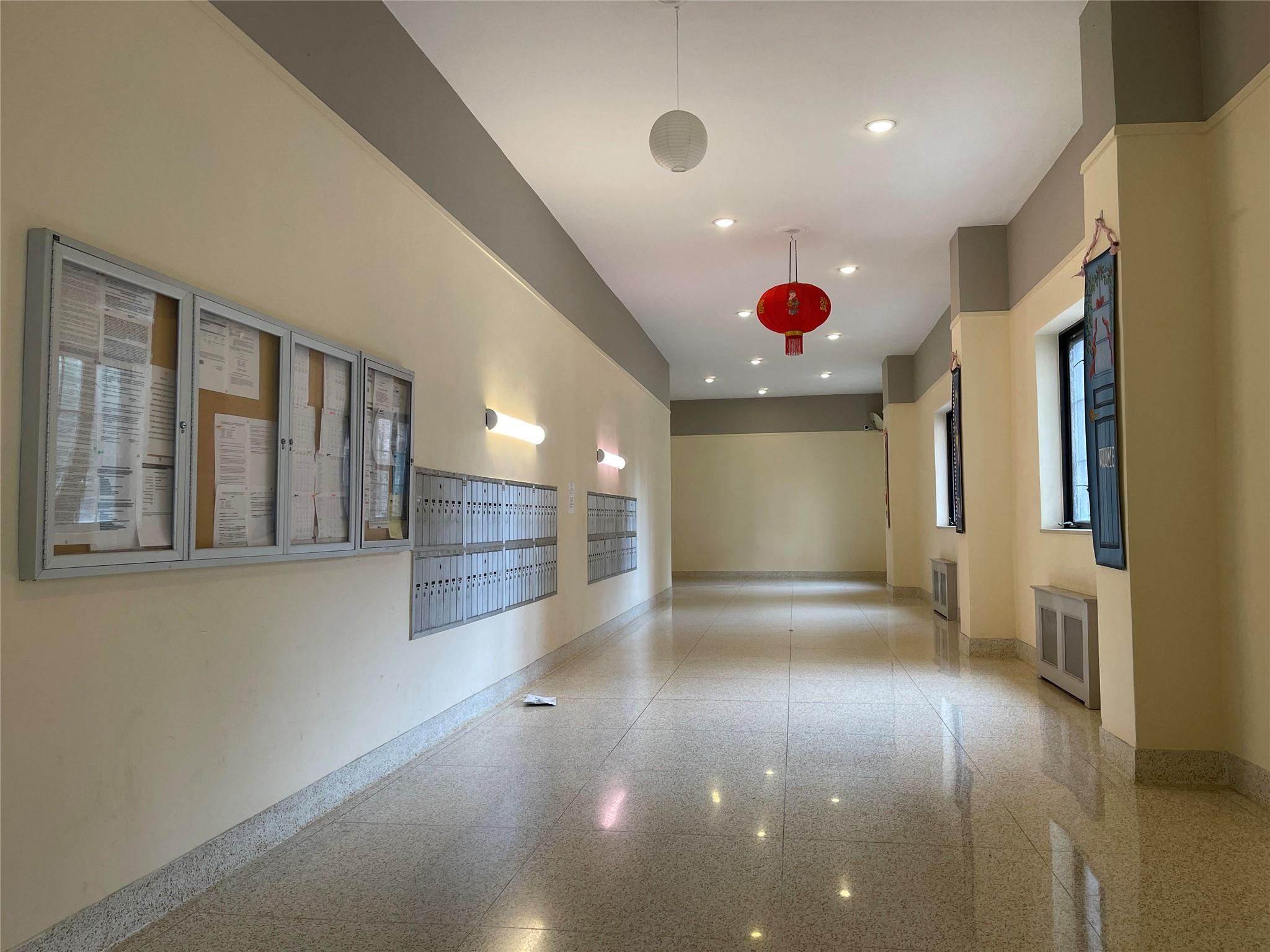 134-54 Maple Avenue, Unit 2S Queens, NY 11355 - Photo 5 of 18 a view of an empty room with a window