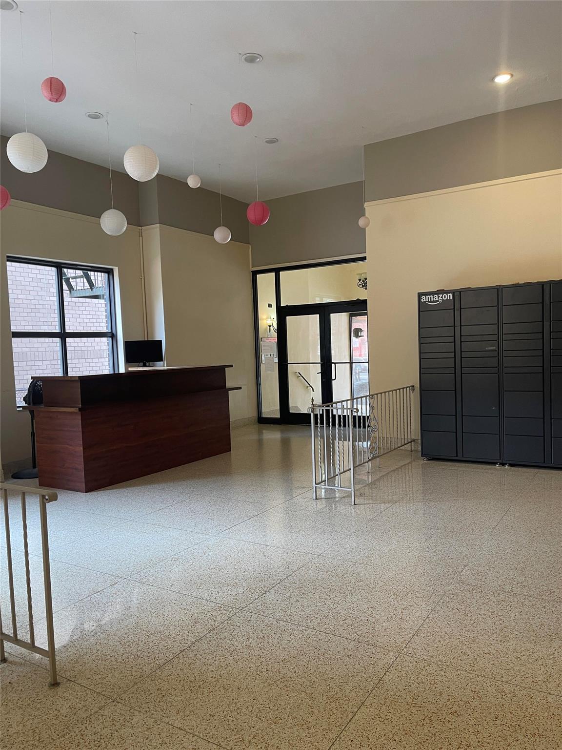 134-54 Maple Avenue, Unit 2S Queens, NY 11355 - Photo 6 of 18 a living room with furniture and a flat screen tv