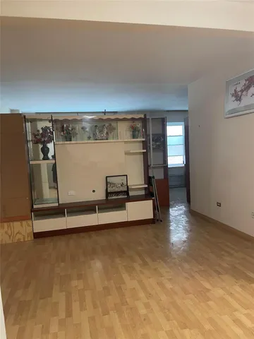 a kitchen with a refrigerator and a sink