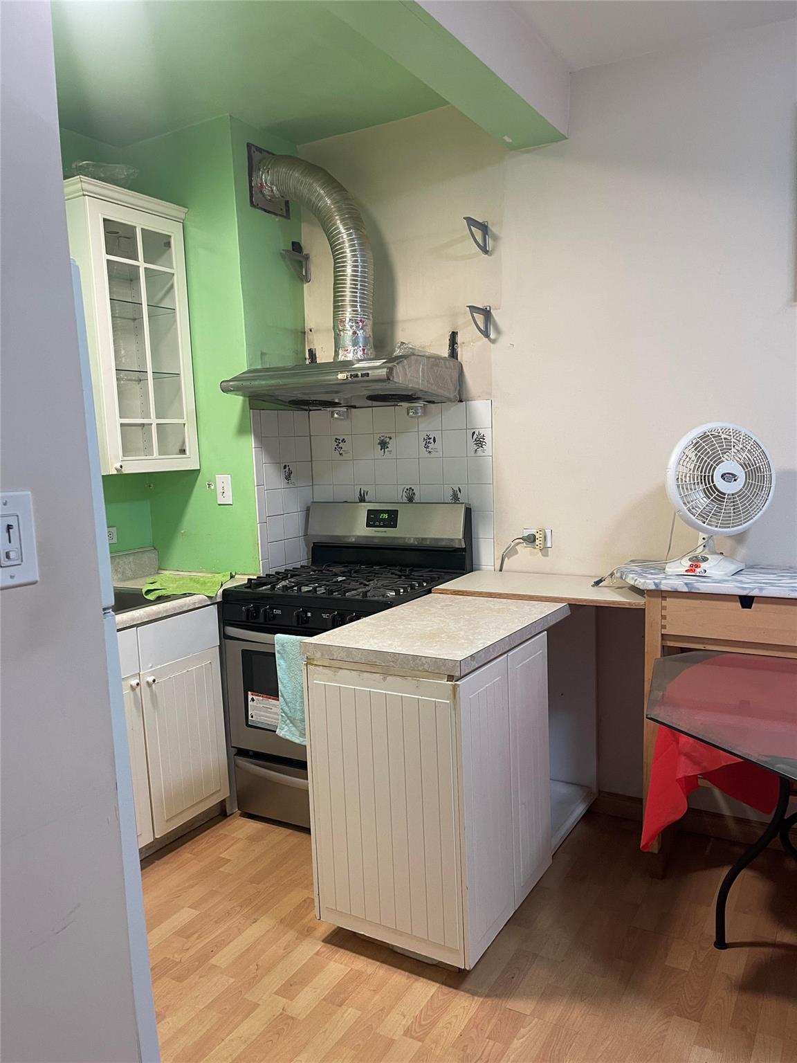 134-54 Maple Avenue, Unit 2S Queens, NY 11355 - Photo 10 of 18 a utility room with dryer and washer