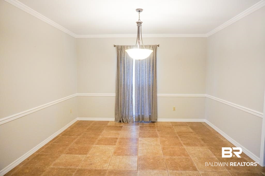 255 Suffolk Road Mobile, AL 36608 - Photo 12 of 29 Spare room with crown molding