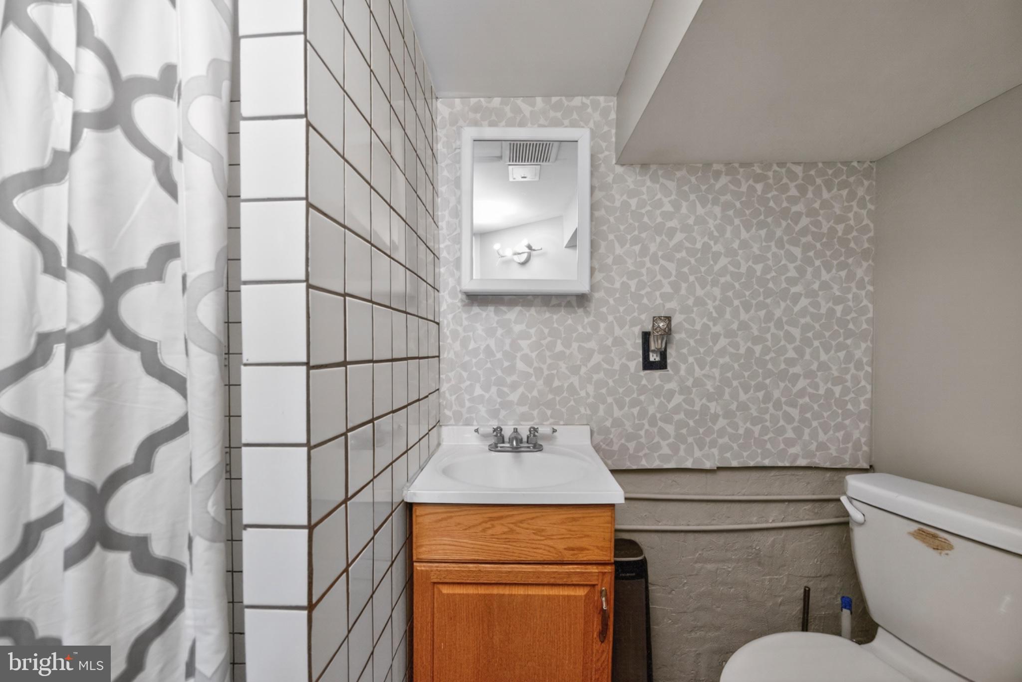 946 Martin Road Essex, MD 21221 - Photo 37 of 48 Charming bathroom with modern accents.