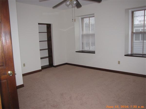 325 Mammoth Road, Unit 2 Lowell, MA 01854 - Photo 3 of 9 an empty room with windows and closet