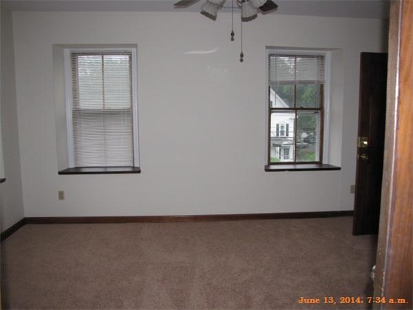 325 Mammoth Road, Unit 2 Lowell, MA 01854 - Photo 6 of 9 an empty room with windows
