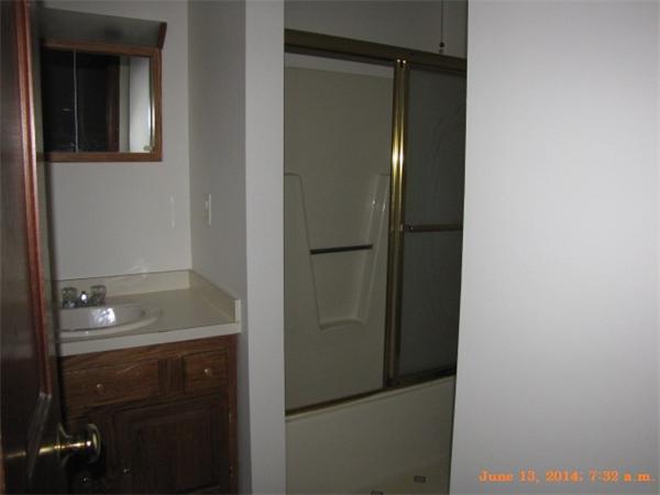 325 Mammoth Road, Unit 2 Lowell, MA 01854 - Photo 9 of 9 a bathroom with a shower and a sink