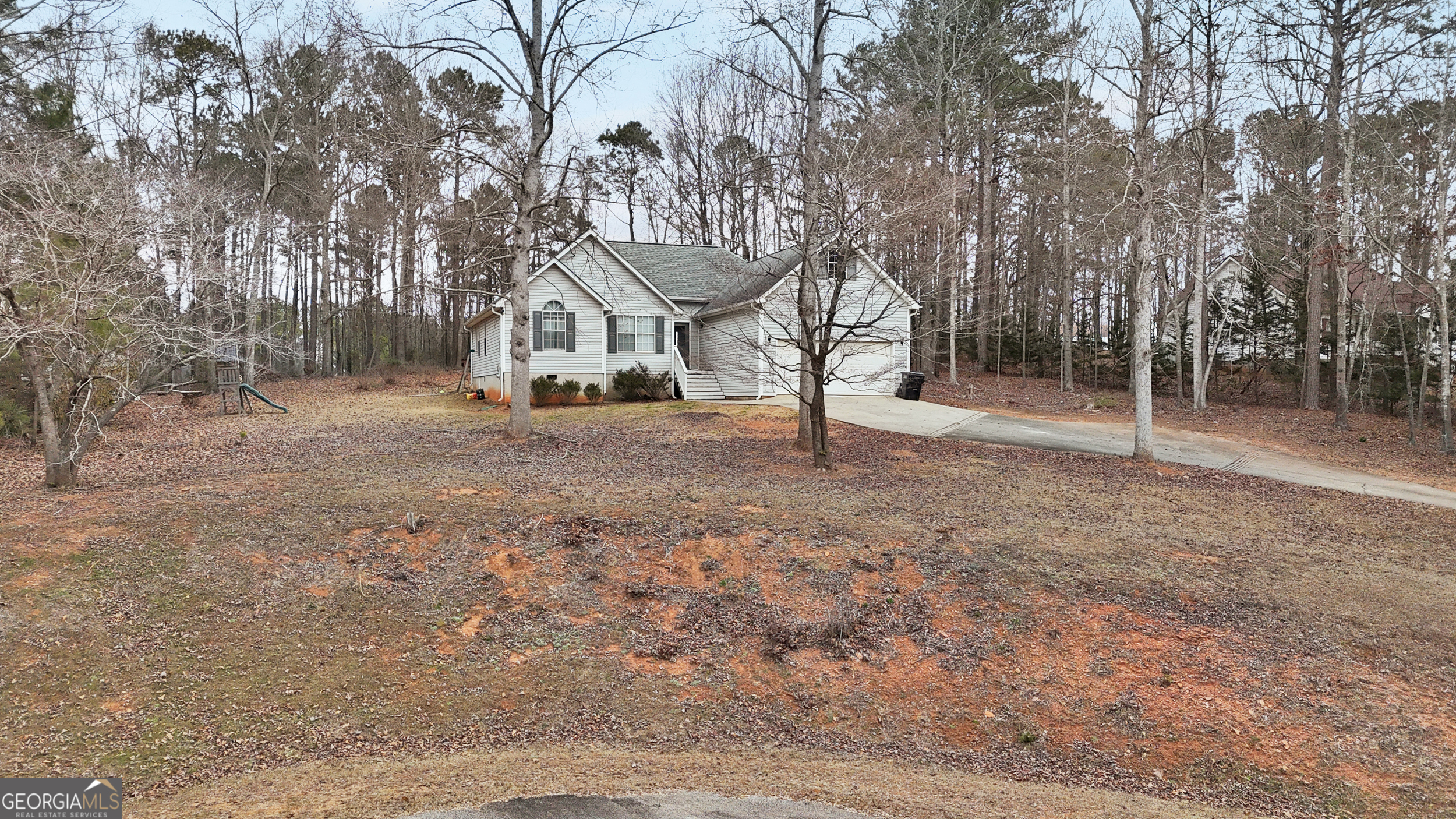 192 Duncans Mill Road Locust Grove, GA 30248 - Photo 17 of 17 a view of house with a backyard space