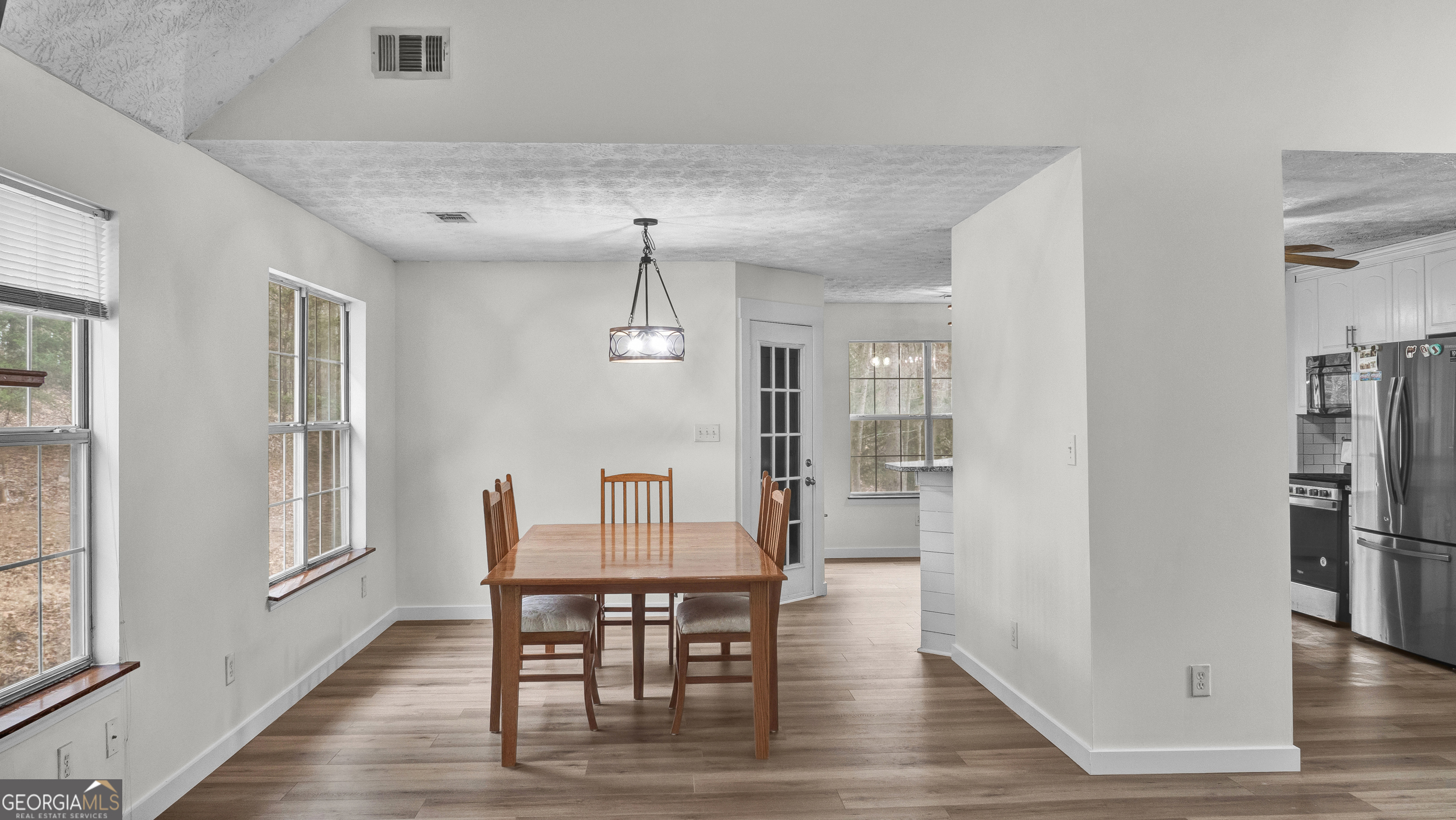 192 Duncans Mill Road Locust Grove, GA 30248 - Photo 7 of 17 a view of a dining room with furniture window and wooden floor