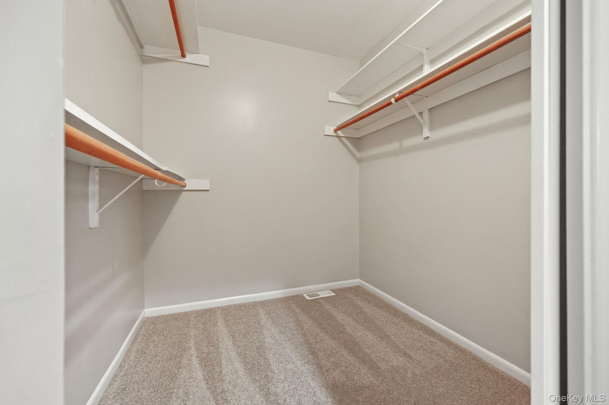 42 Timber Ridge Mount Kisco, NY 10549 - Photo 23 of 39 Spacious, carpeted primary walk-in closet