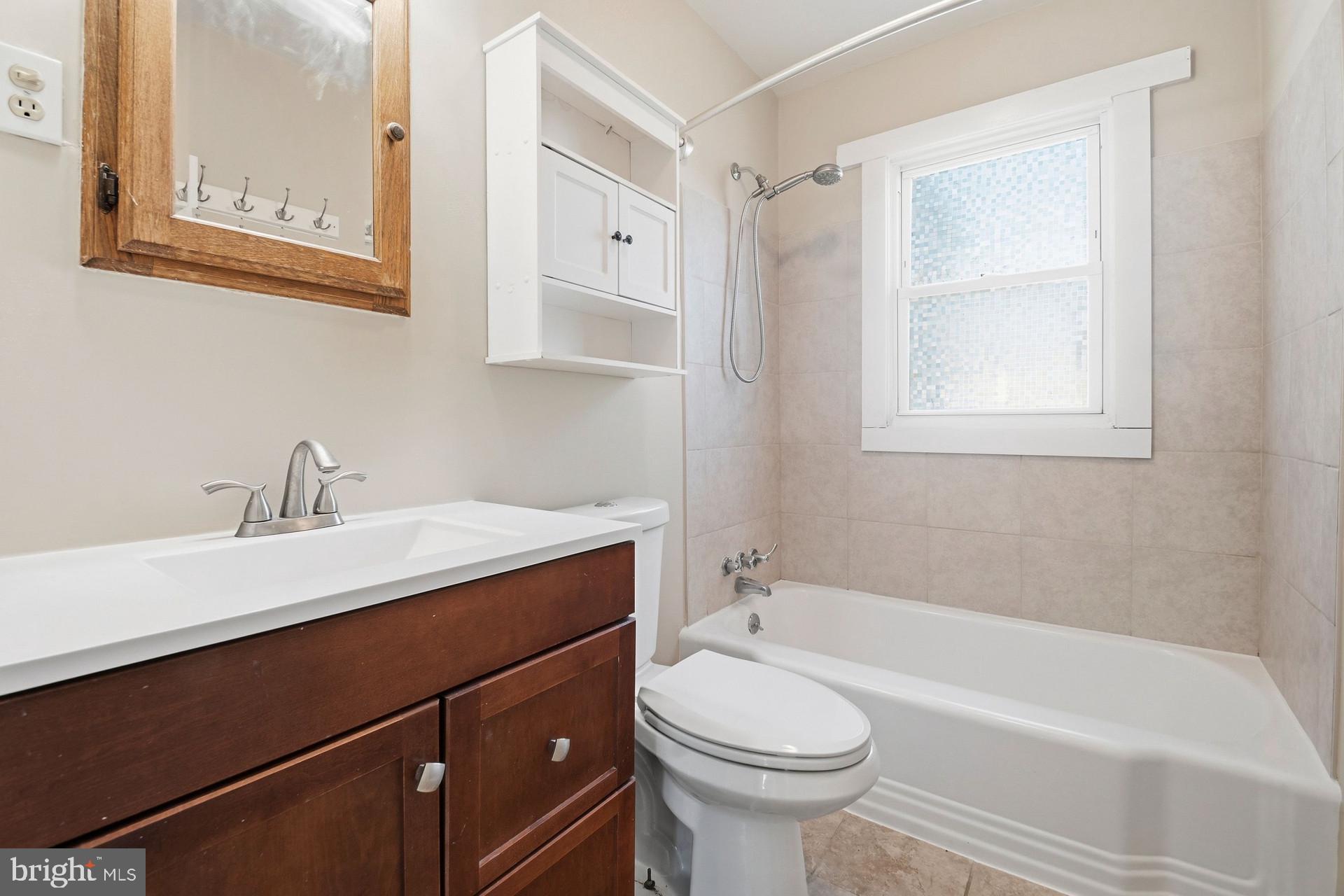 8444 Garden Road Pasadena, MD 21122 - Photo 14 of 28 1ST FLOOR FULL BATHROOM