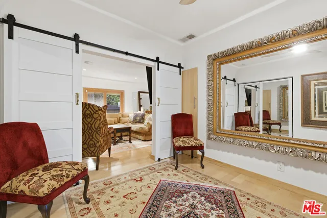 a living room with furniture and a rug