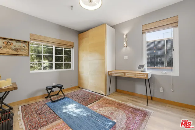 a room that has a window and a table in it