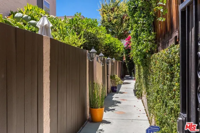 a hallway with flowers in front of it