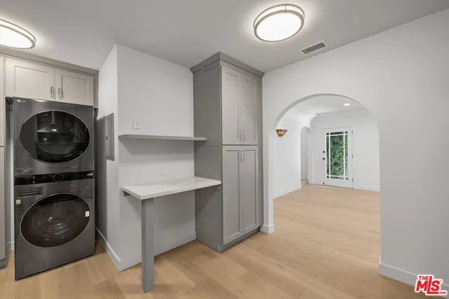 a view of a hallway with washer and dryer