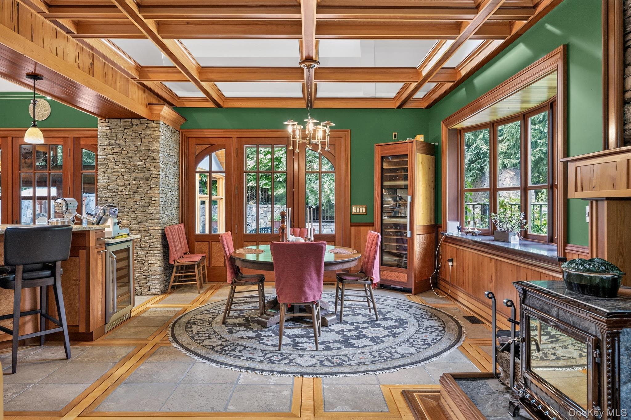 23 Inningwood Road Ossining, NY 10562 - Photo 22 of 50 Spacious interior featuring a coffered wood ceiling, stone veneer column, built-in wine refrigeration, and large wood-framed windows