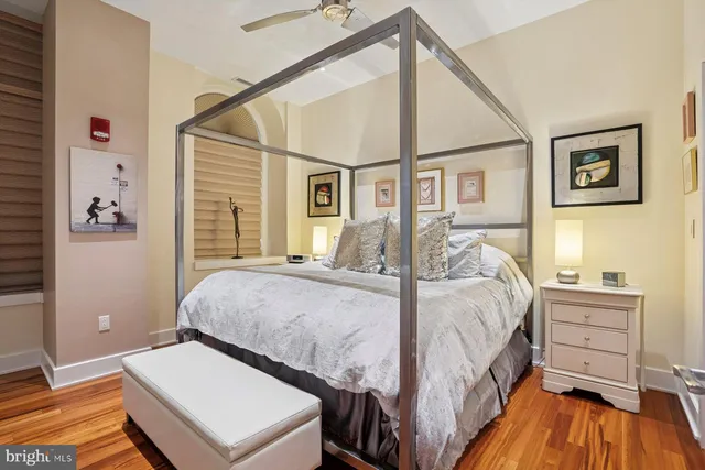 a bedroom with a bed and a table