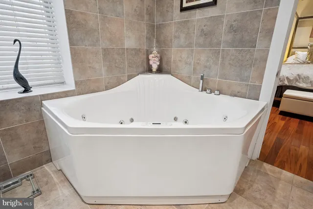 a white bath tub sitting in a bathroom
