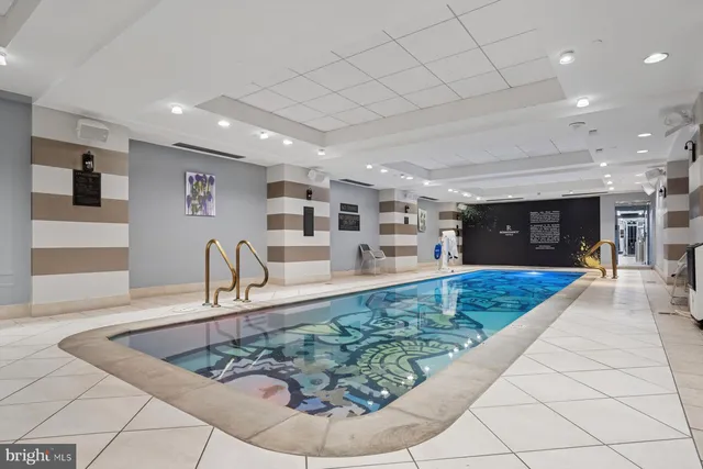 a view of a living room and a hall with a couch