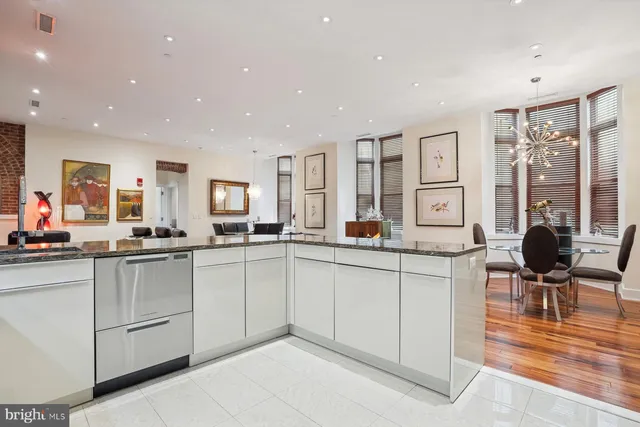 a kitchen with sink and cabinets