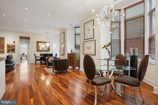 a view of a livingroom with furniture window and wooden floor