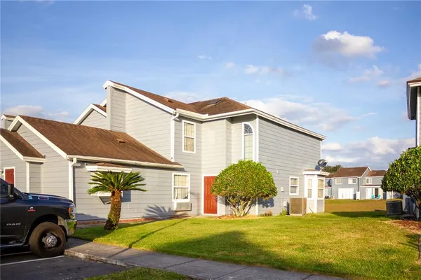 a view of a house with a yard