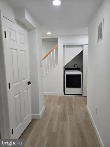 a bathroom with a glass shower door