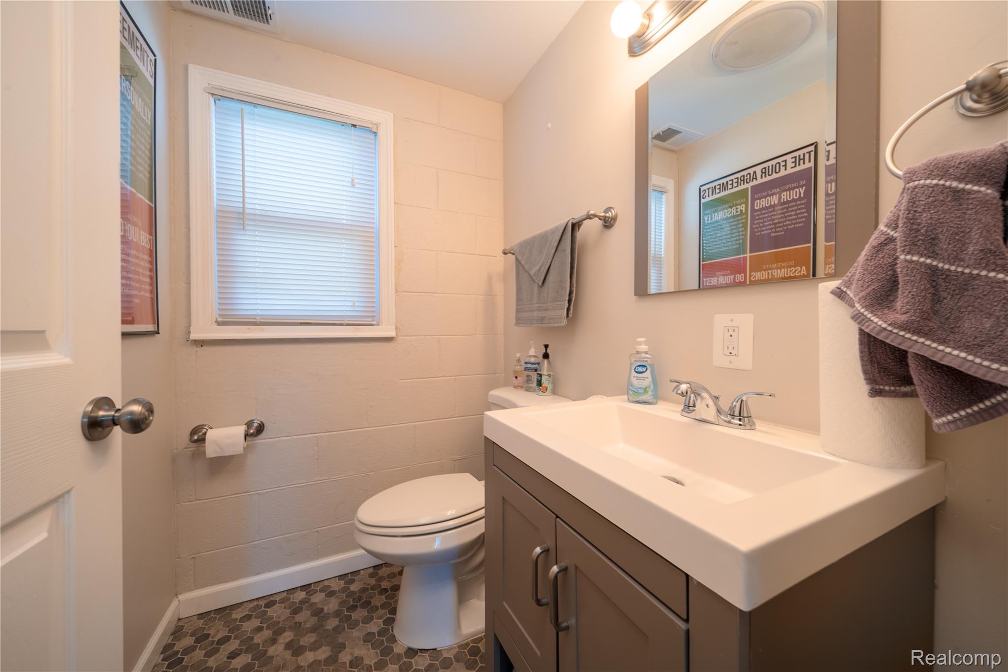 18 East Rutgers Avenue Pontiac, MI 48340 - Photo 8 of 19 Bathroom featuring vanity and toilet