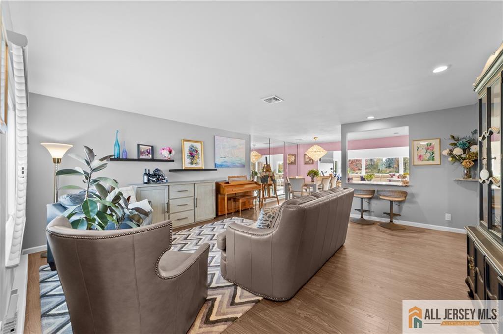 264A Glen Road, Unit 264A Monroe Township, NJ 08831 - Photo 11 of 31 a living room with furniture and a potted plant