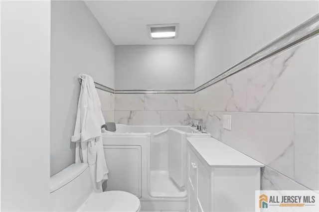 a bathroom with a sink and toilet