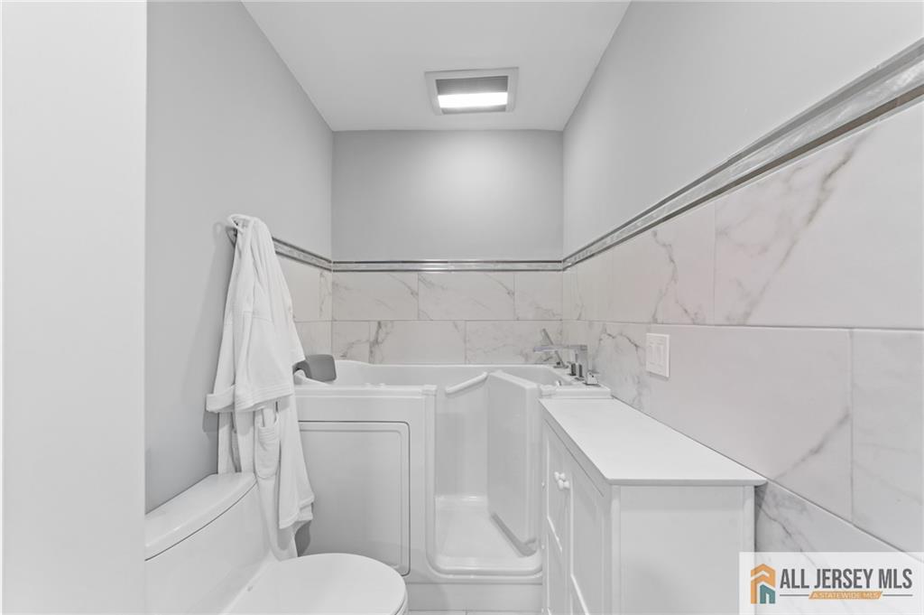 264A Glen Road, Unit 264A Monroe Township, NJ 08831 - Photo 21 of 31 a bathroom with a sink and toilet