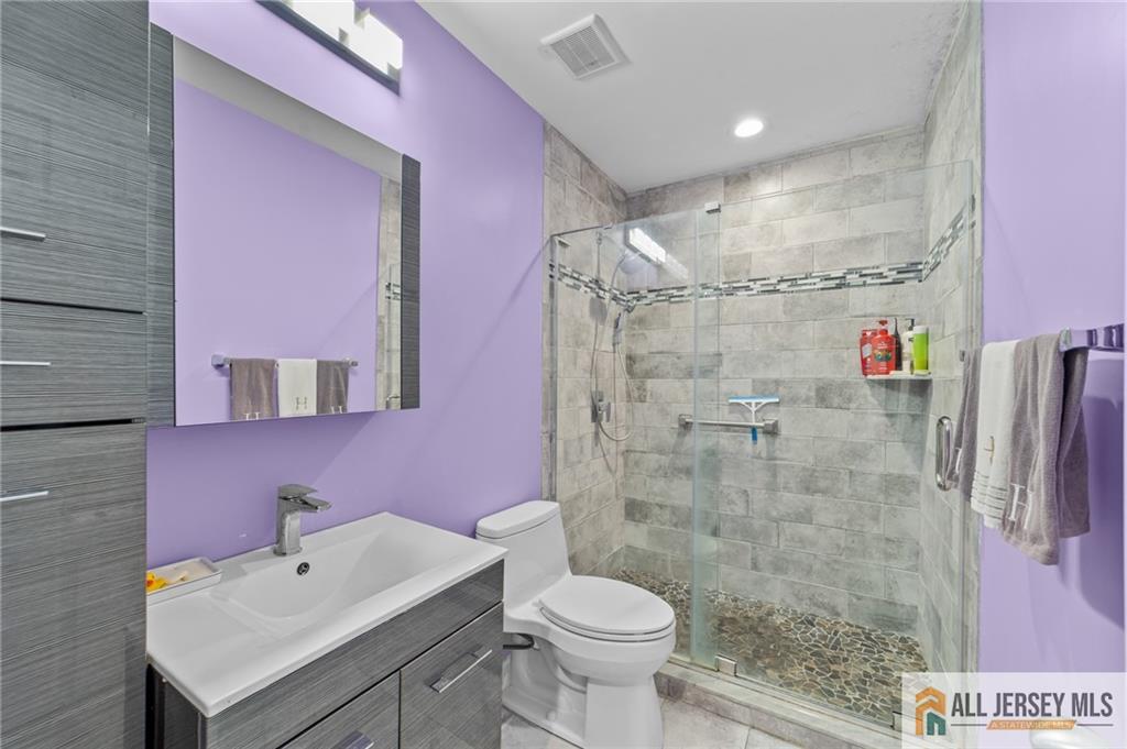 264A Glen Road, Unit 264A Monroe Township, NJ 08831 - Photo 22 of 31 a bathroom with a sink a toilet and shower