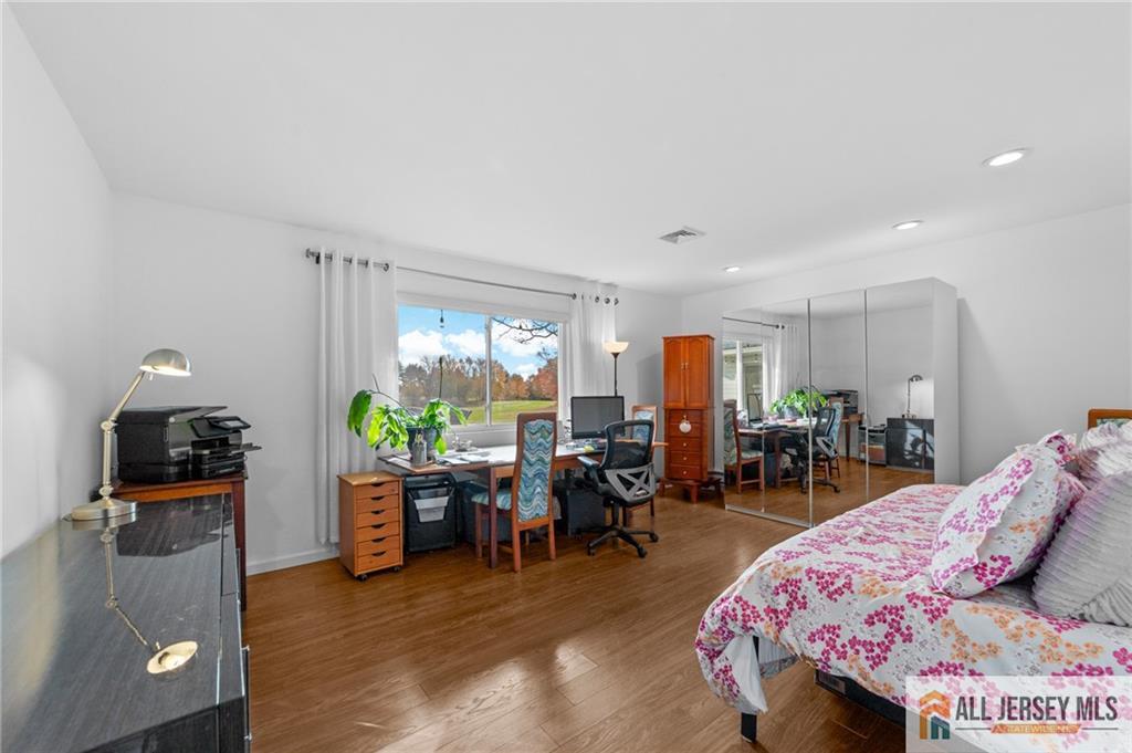 264A Glen Road, Unit 264A Monroe Township, NJ 08831 - Photo 23 of 31 a living room with furniture and wooden floor