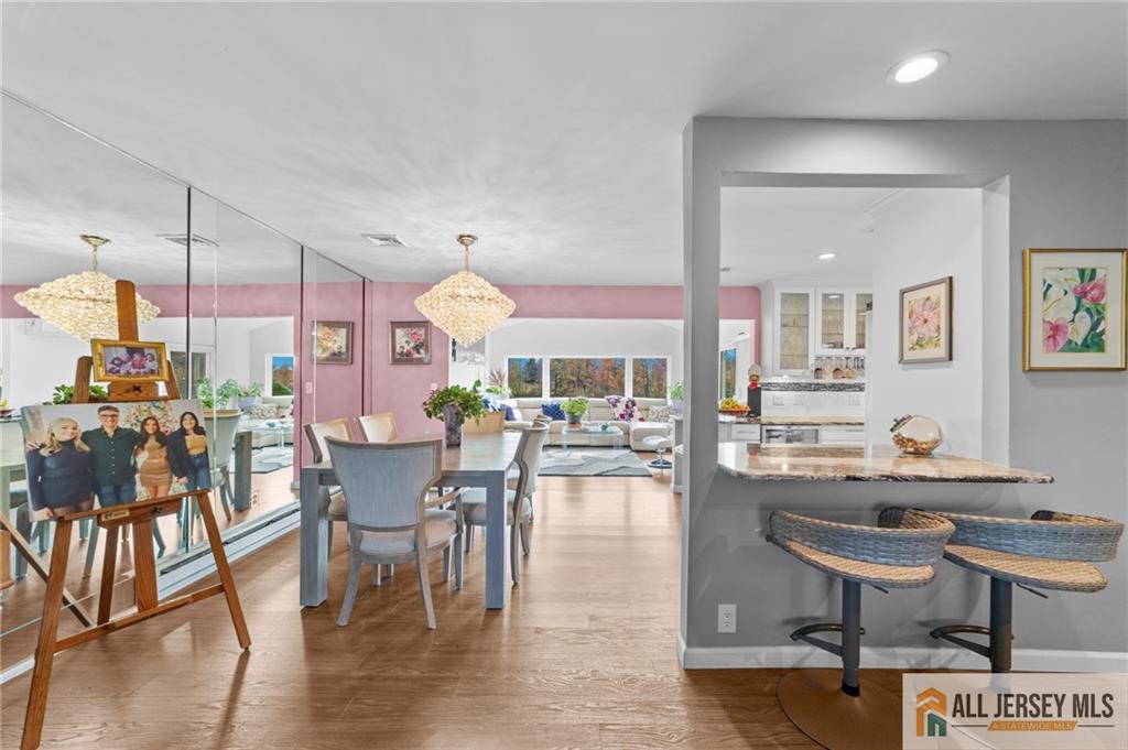 264A Glen Road, Unit 264A Monroe Township, NJ 08831 - Photo 5 of 31 a view of a dining room with furniture and wooden floor