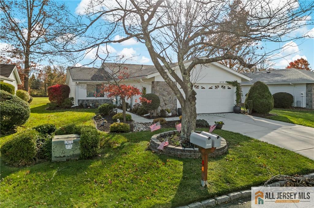 264A Glen Road, Unit 264A Monroe Township, NJ 08831 - Photo 6 of 31 a backyard of a house with fireplace table and chairs