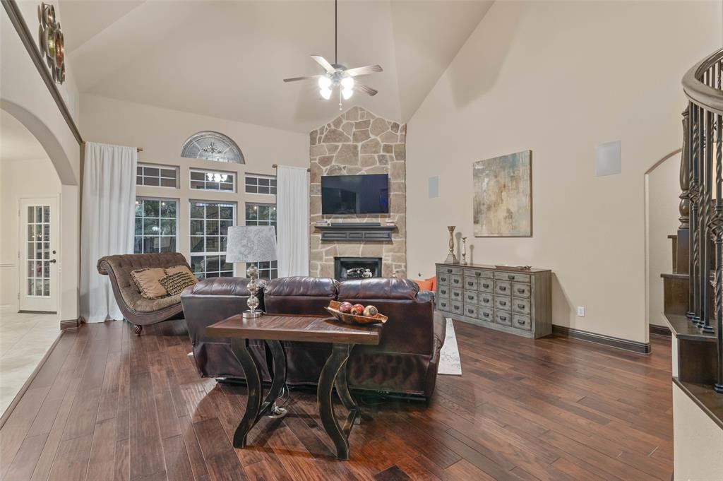 6809 Edwards Road Denton, TX 76208 - Photo 8 of 40 Grand living room with stone fireplace and kitchen to the left
