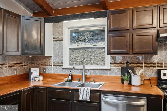 a room with wooden floors and lots of counter top space