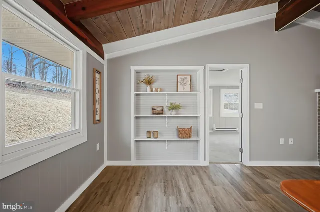 a shelf with books and knick knacks on it