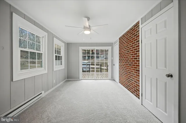 a bathroom with a toilet a sink and glass door
