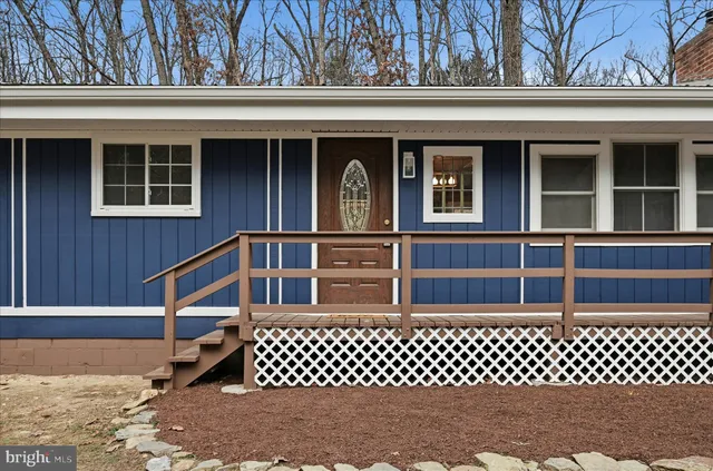 a view of a kitchen with furniture and a fireplace