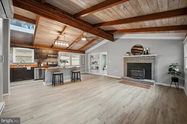 a view of livingroom with fireplace and window