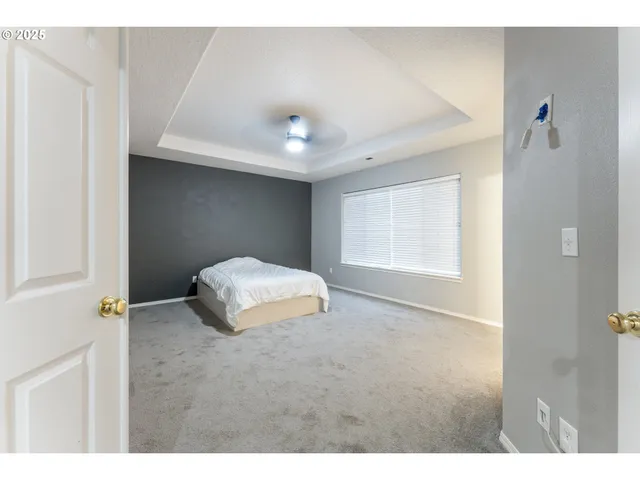 a bathroom with a granite countertop sink mirror and bathtub