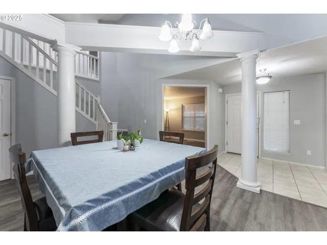 a view of kitchen and hall with wooden floor