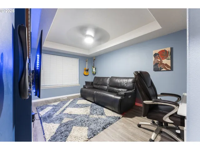 a living room with furniture and a rug