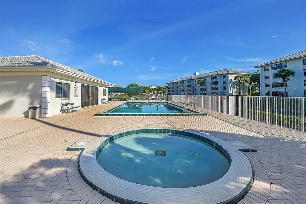 6109 Balboa Circle, Unit 305 Boca Raton, FL 33433 - Photo 1 of 22 a view of a swimming pool with a patio